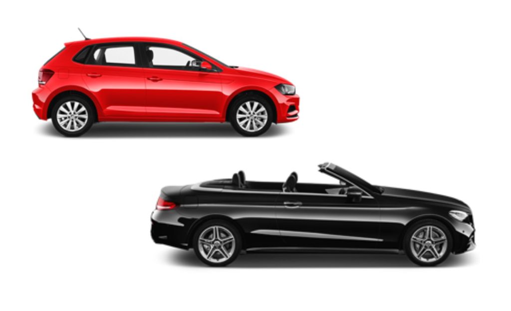 Red and black sports cars parked side by side, showcasing sleek designs.
