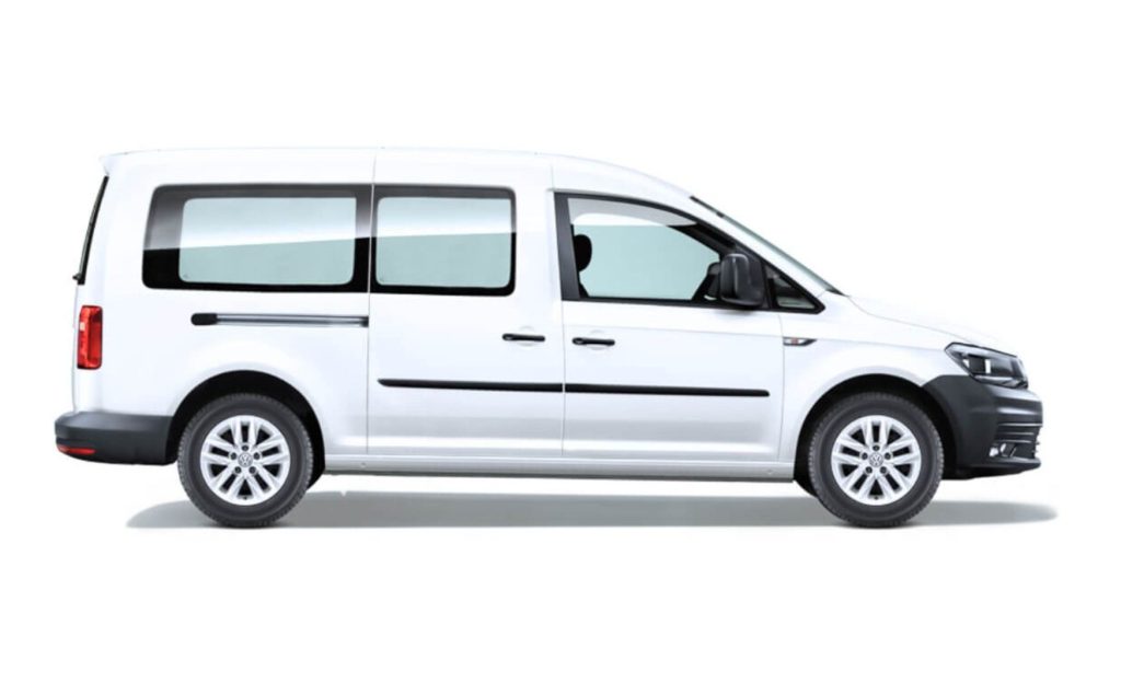 White private shuttle parked, ready for transportation to Tulum.